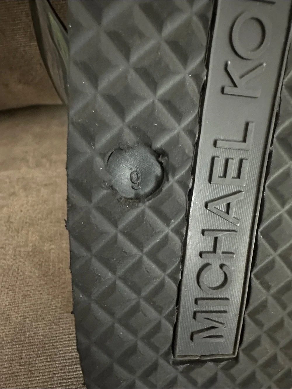 Michael Kors flip flops.  New W/O tags. Size 9